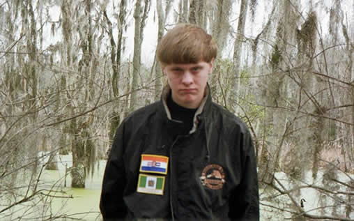 Charleston shooting suspect Dylann Roof wearing jacket displaying old South African and Rhodesian flags