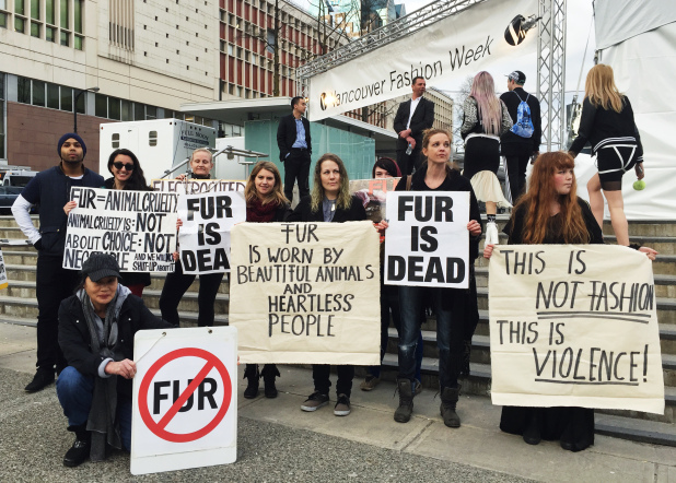 Anti-fur protesters gather outside the tent at Vancouver Fashion Week on Tuesday, March 17, 2015 to protest JUKOJulie's use of fur in her collection.